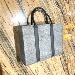 New grey structured tote bag by La Prairie felt like man made material